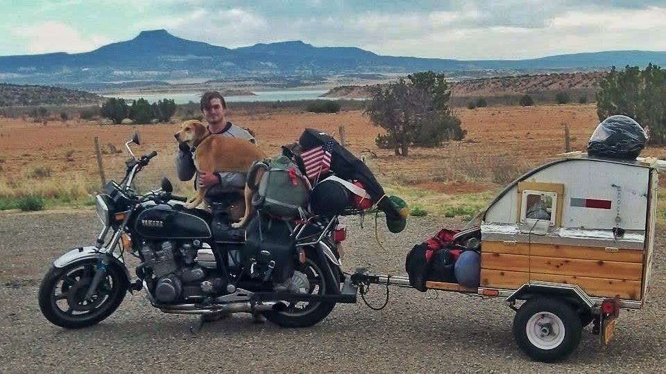 A man and his dog on a motorcycle journey around the United States